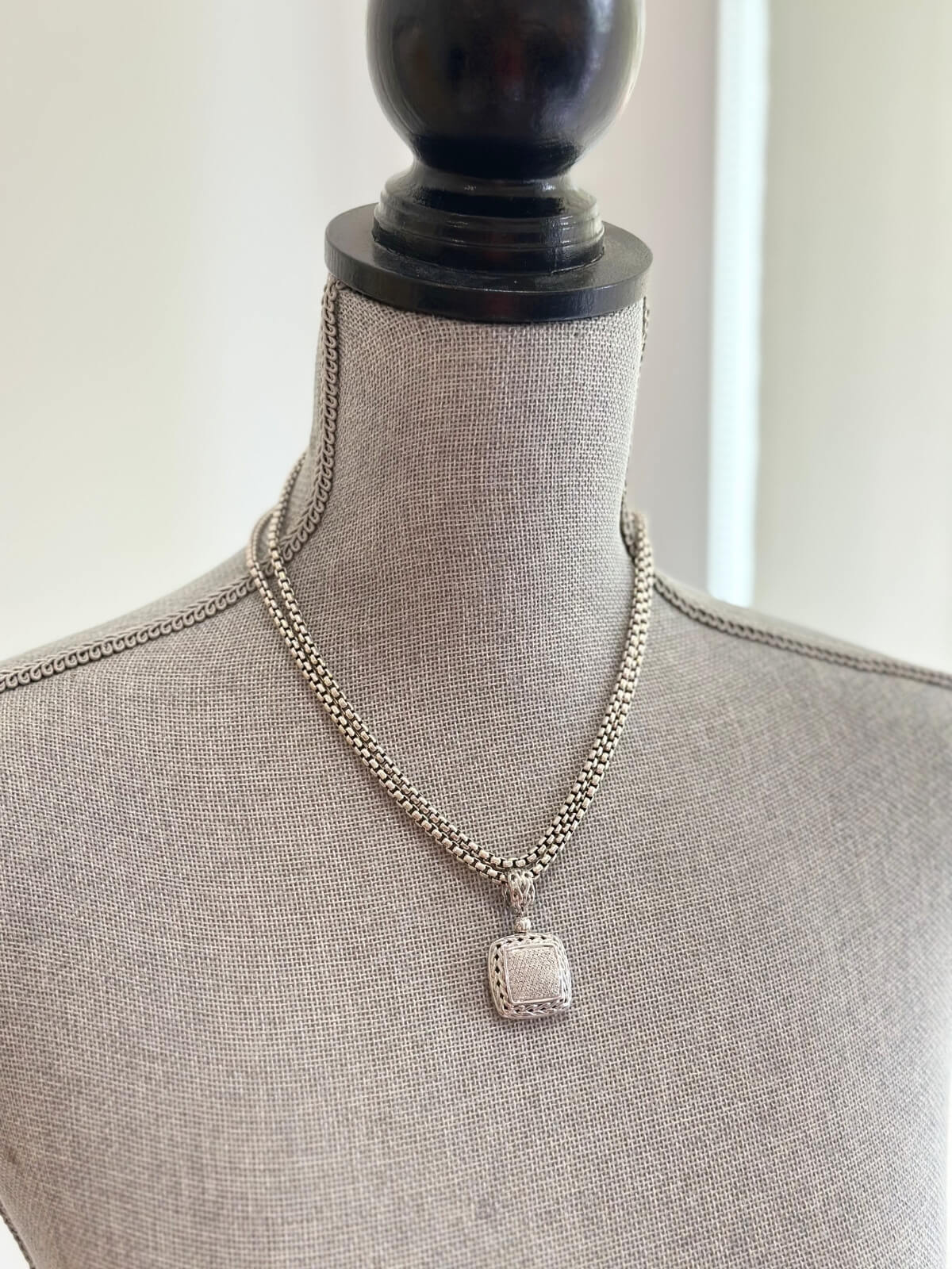 Louise Row featuring John Hardy Diamond Pendant in silver on grey mannequin