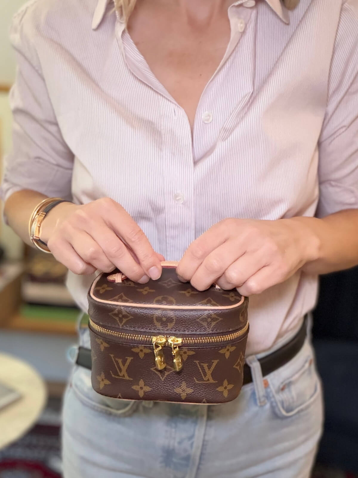 Louise Row featuring model holding LV vanity case