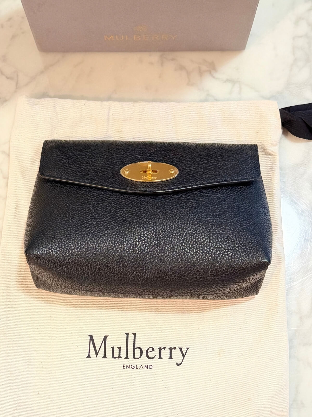 Louise Row featuring Mulberry Cosmetic Bag in black on table