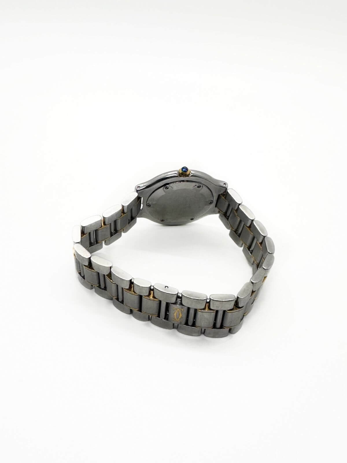 Cartier watch on white background showing clasp.