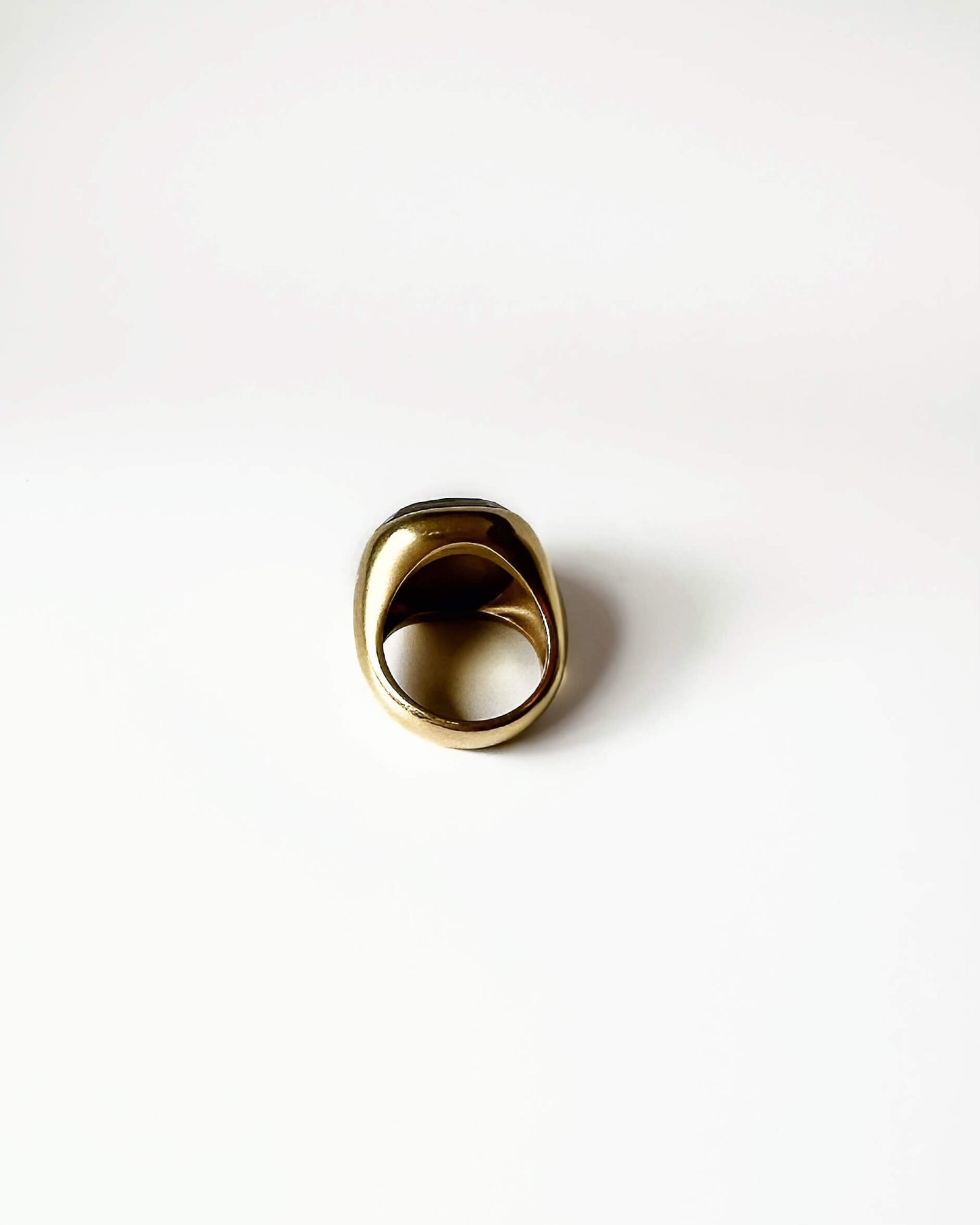 Back of Gold ring on a white background