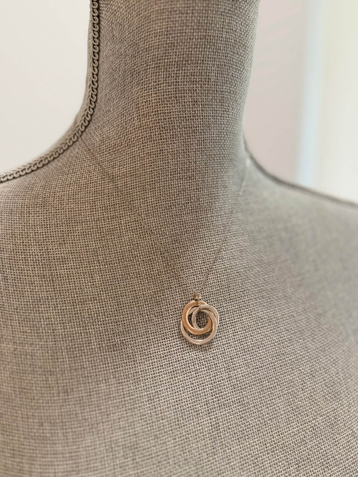 Louise Row featuring Tiffany & Co Circles Necklace on grey Mannequin