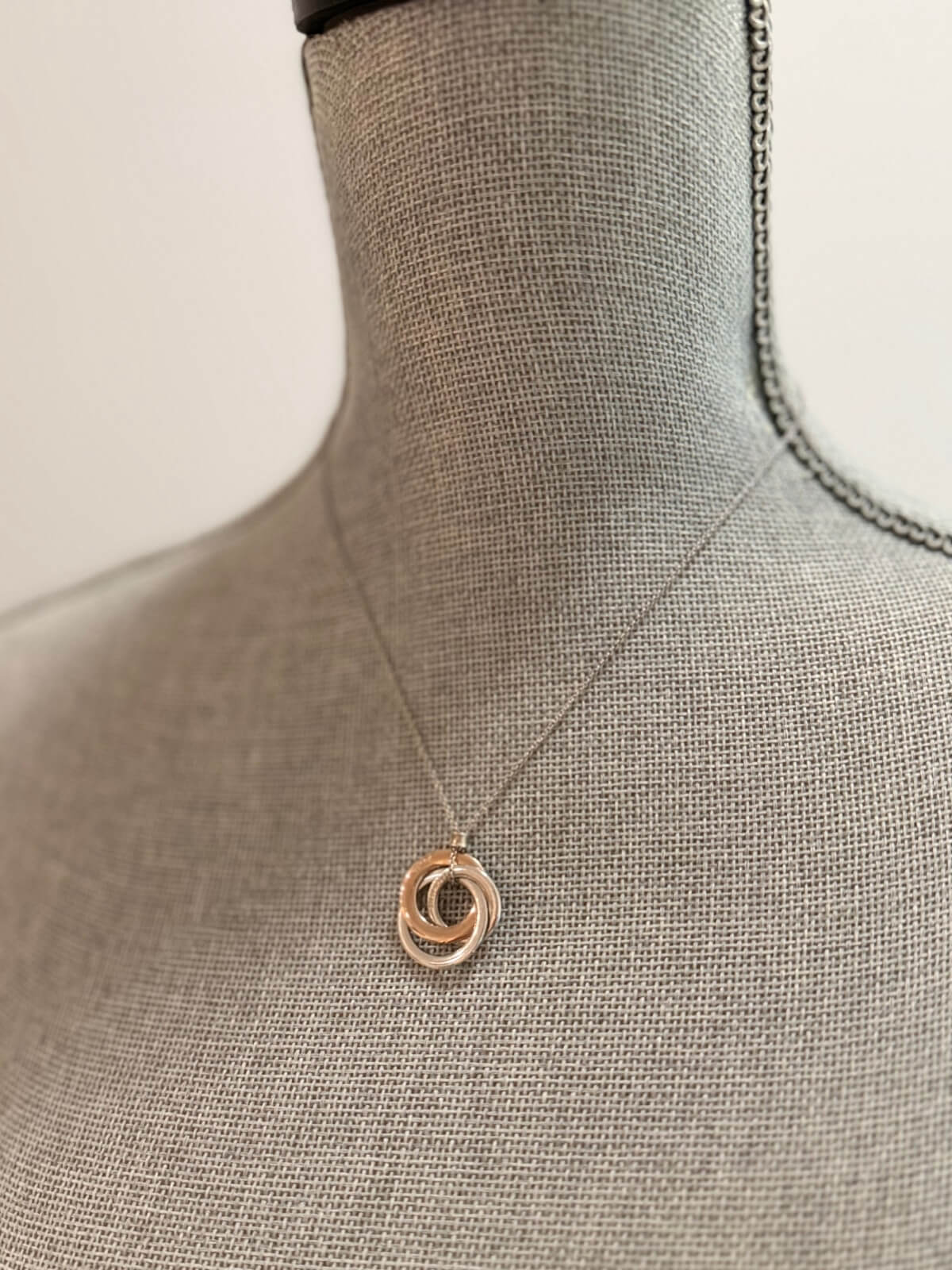 Louise Row featuring Tiffany & Co Circles Necklace on grey Mannequin