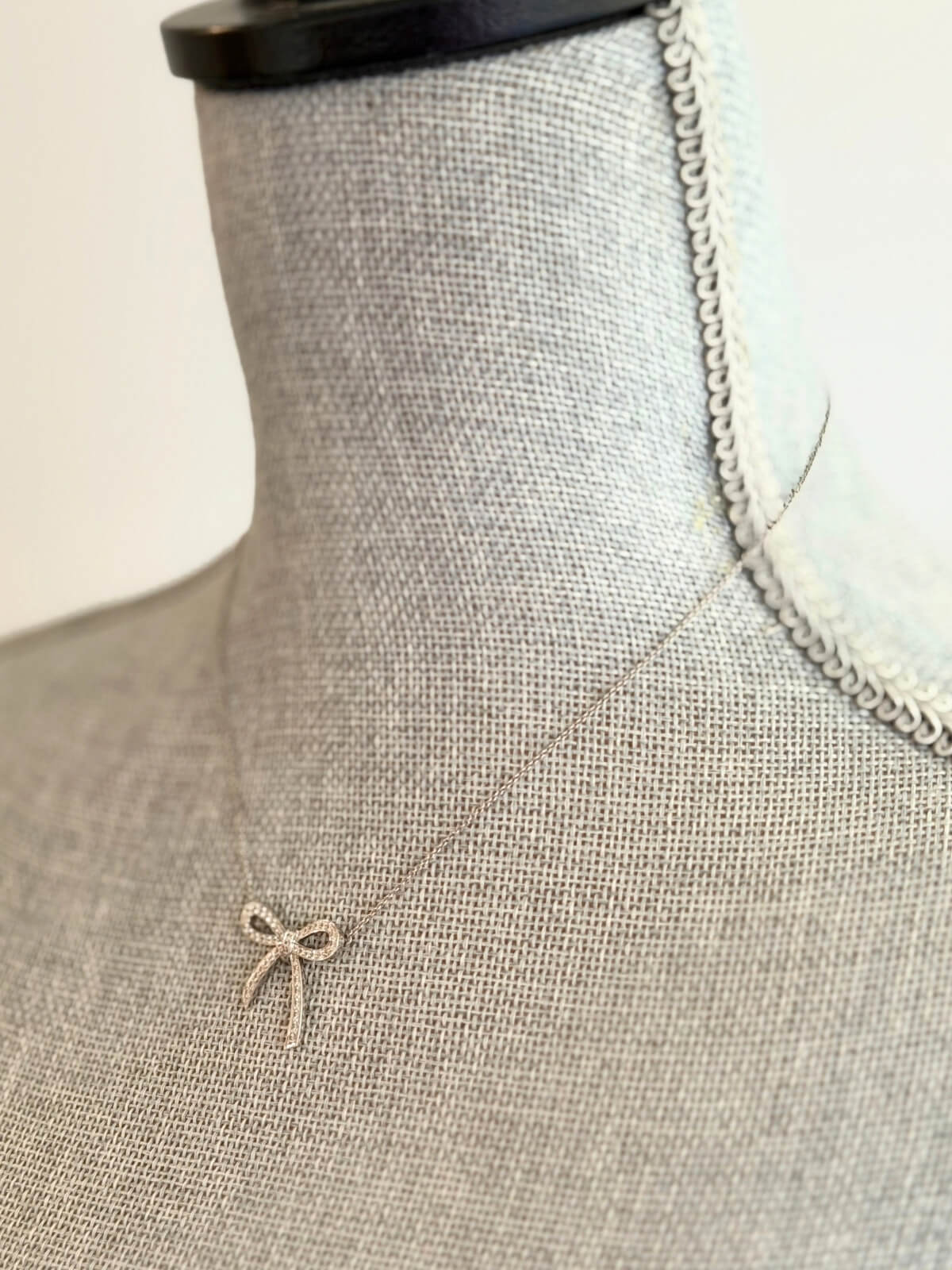 Louise Row featuring Tiffany platinum and diamond bow necklace
