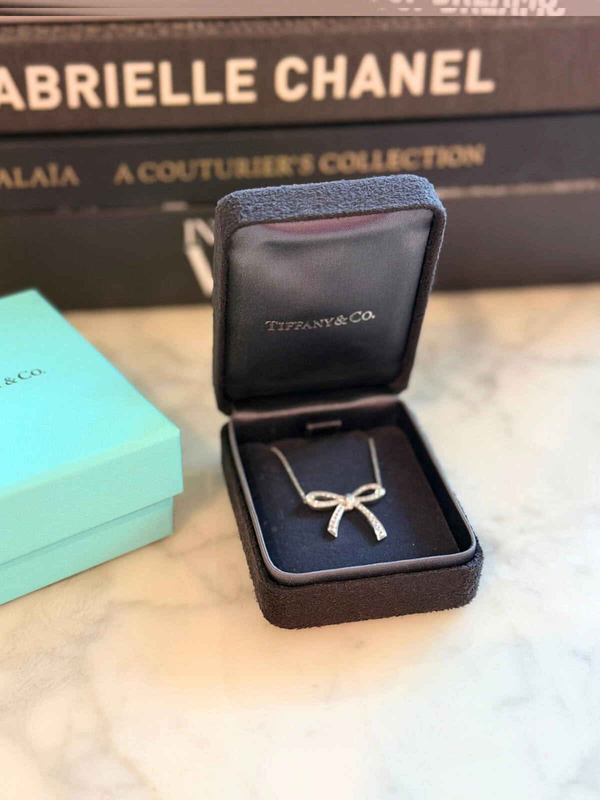 Louise Row featuring Tiffany platinum and diamond bow necklace in box 