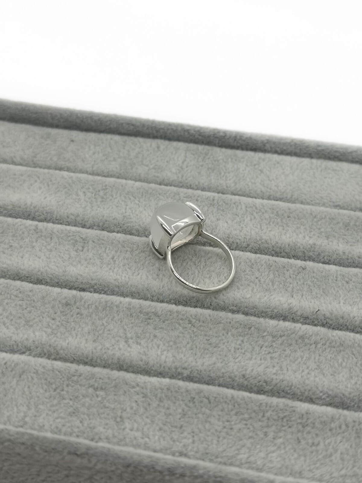 Tiffany silver and quartz ring on grey background