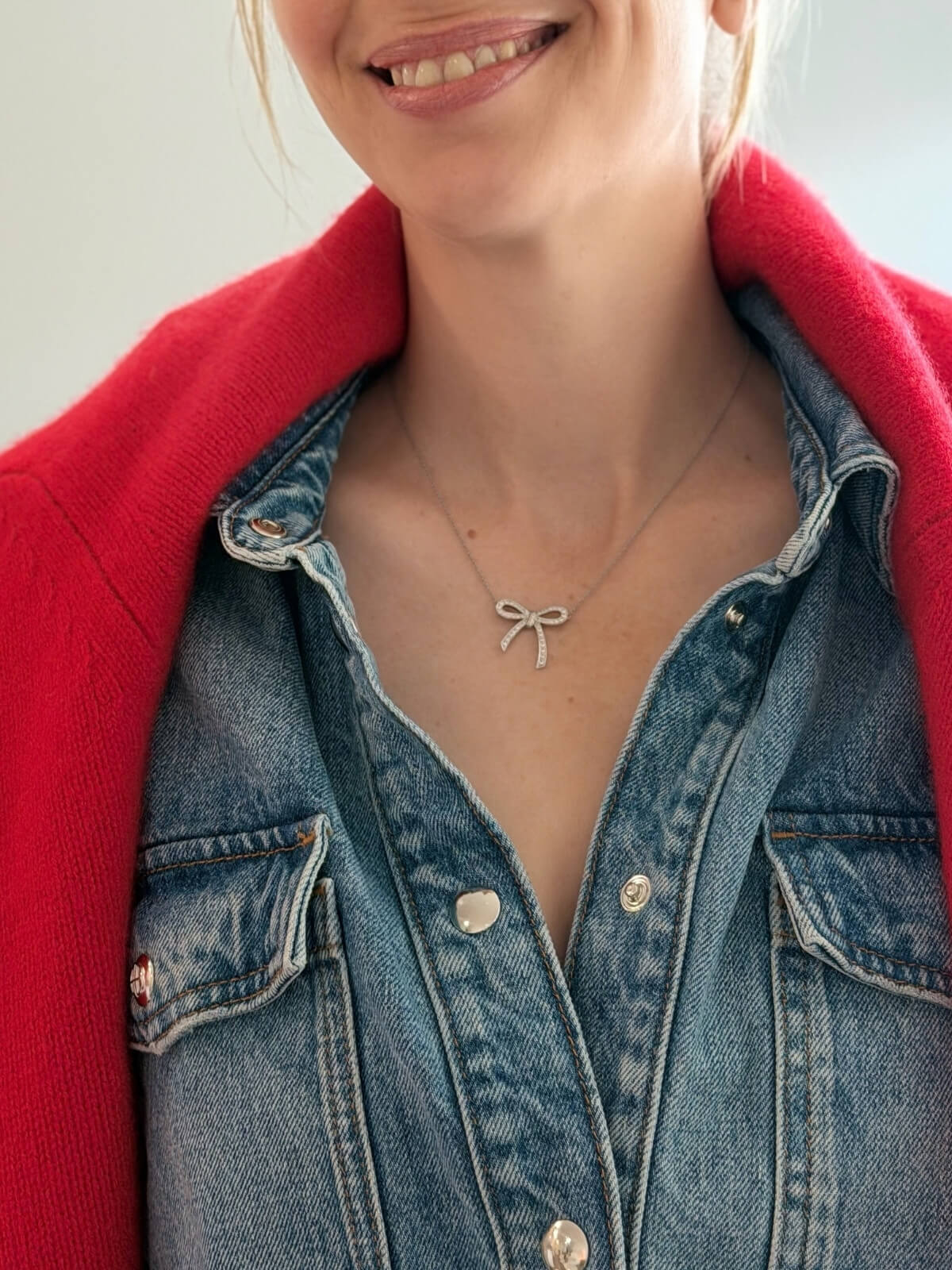 Louise Row featuring Tiffany platinum and diamond bow necklace on model