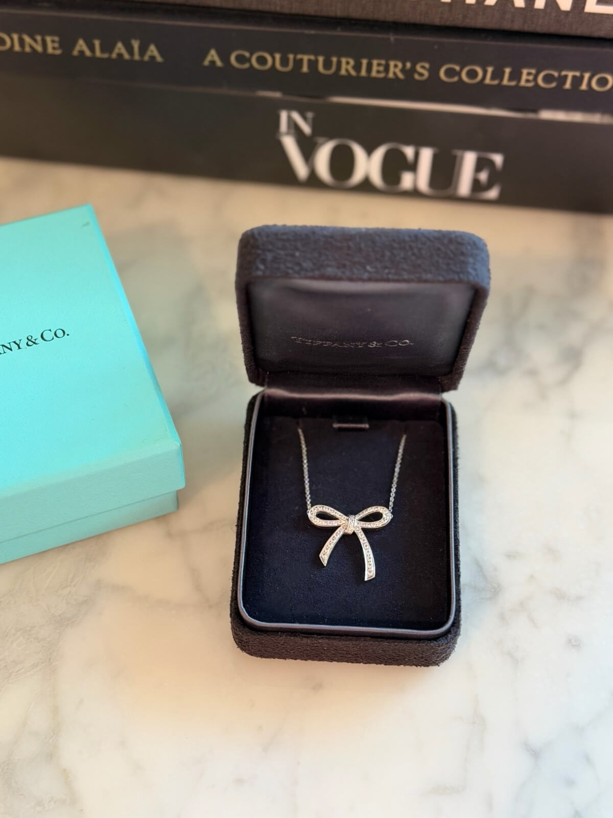 Louise Row featuring Tiffany platinum and diamond bow necklace in box 