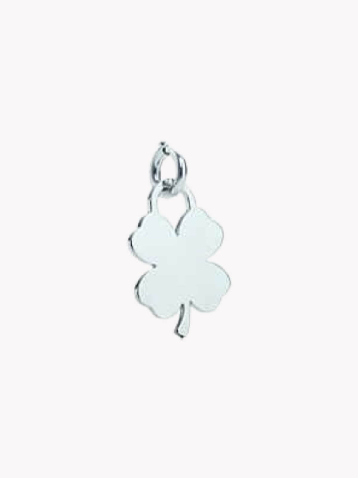 Louise Row Studio , Tiffany & Co Four Leaf clover silver charm on white background. 