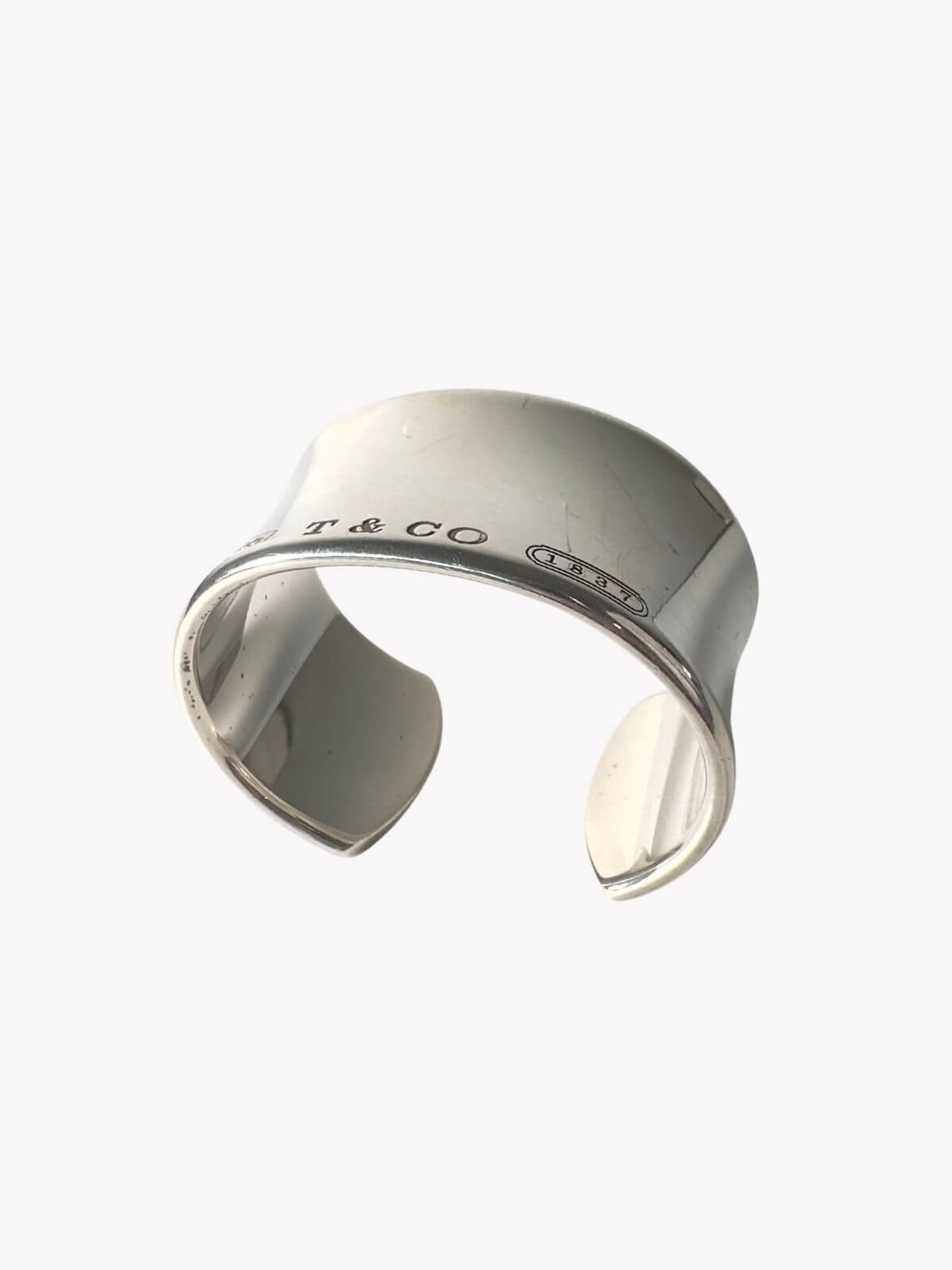 Louise Row Studio featuring Tiffany & Co 1837 Cuff silver on white background