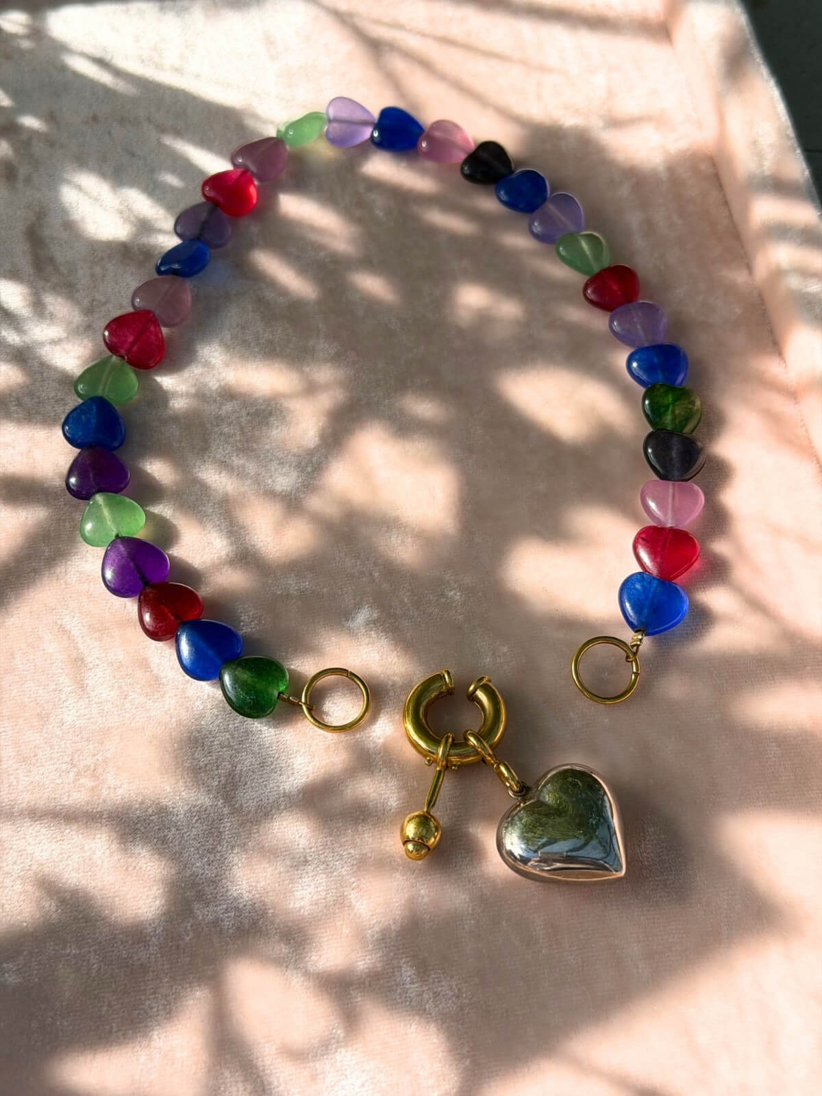 Louise Row featuring Timeless Pearly glass heart necklace on pink tray