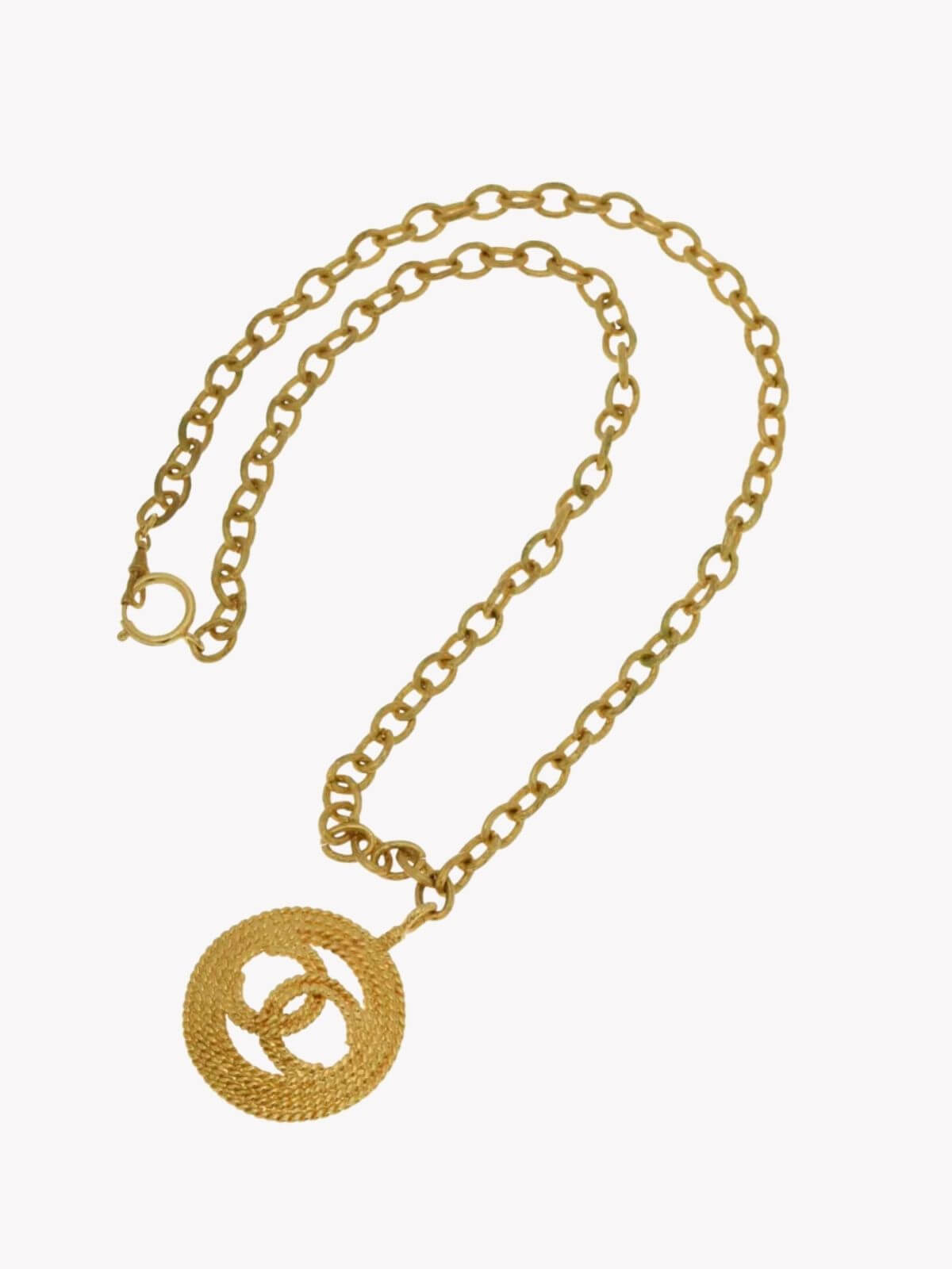 Louise Row Studio featuring Vintage Chanel medallion gold necklace on white background. 