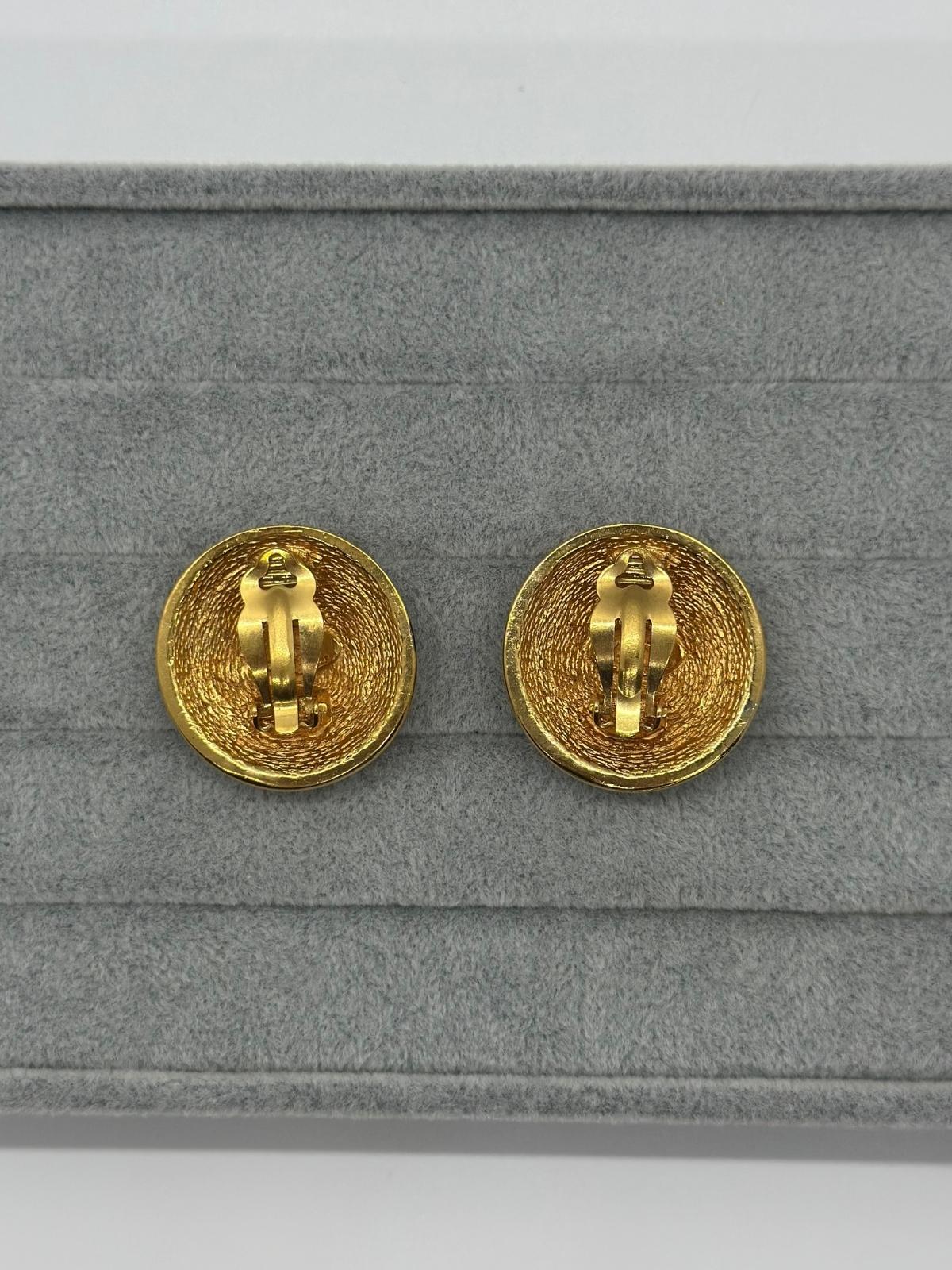 Vintage Chanel Matelasse Round Earrings on grey backround , Back view