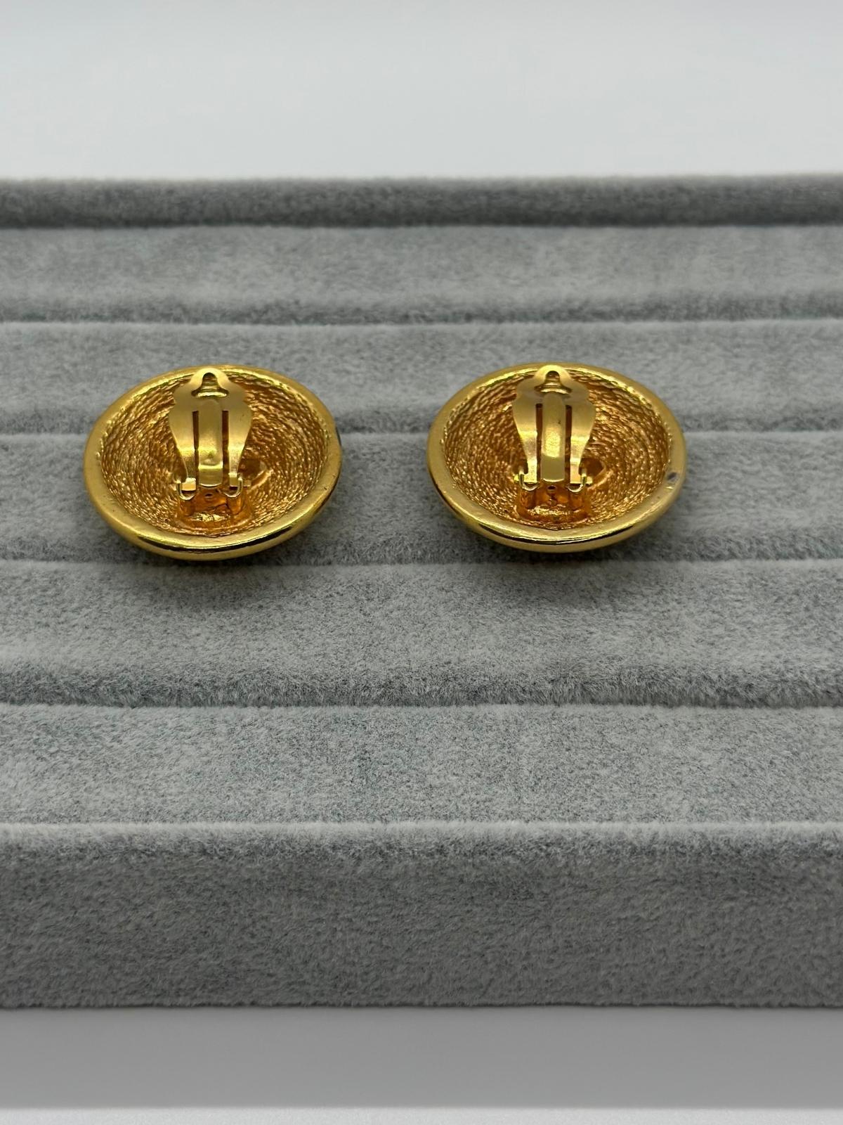 Vintage Chanel Matelasse Round Earrings on grey backround , Back view