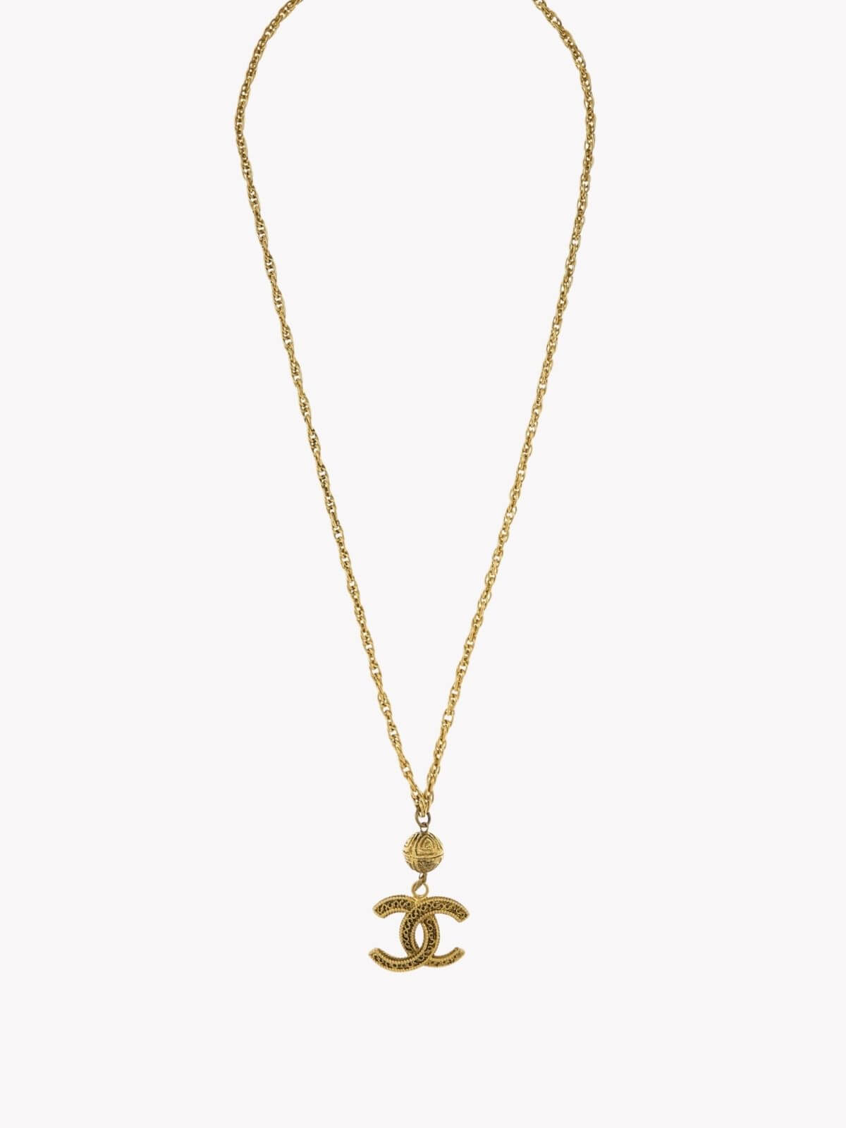 Louise Row Studio vintage Gold Chanel necklace with a CC pendant on a white background