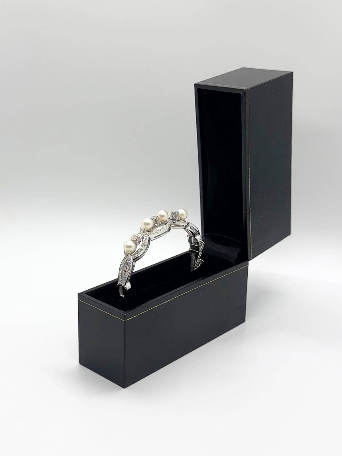 White gold and pearl bracelet in black box